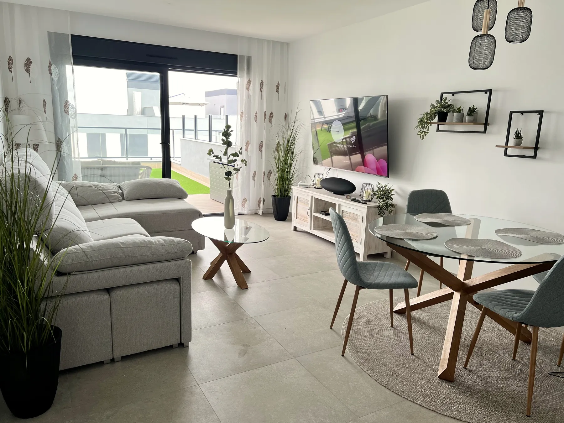 Living and dining area with 75-inch TV