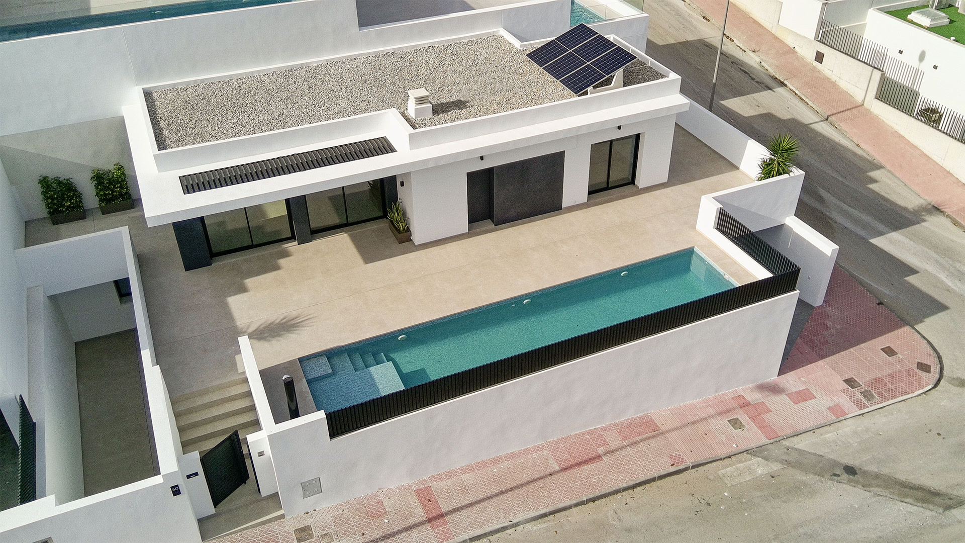 Aerial view with pool and solar panels