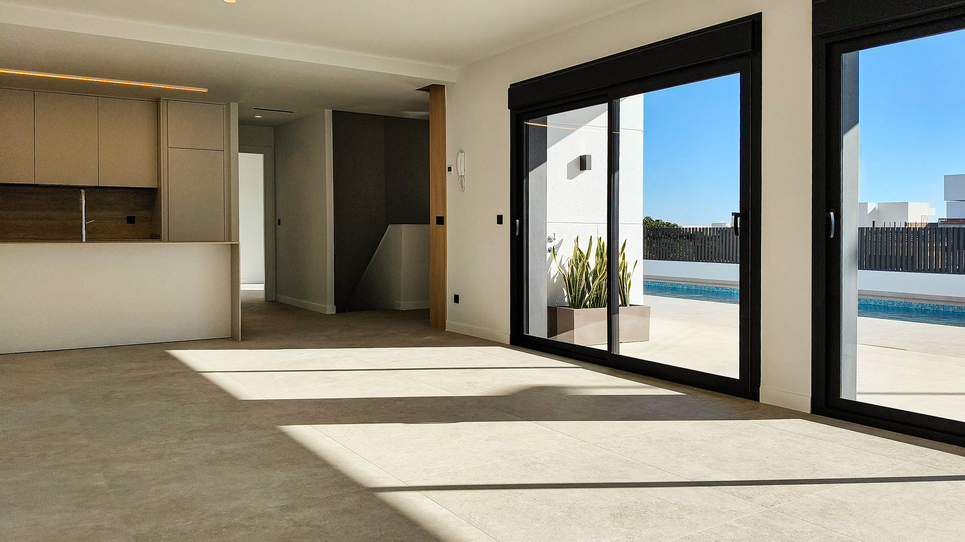 Open kitchen and living area with terrace access