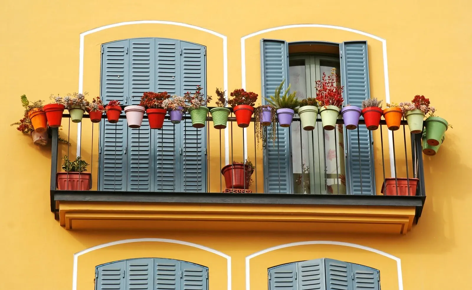Balcony with colourful flower pots